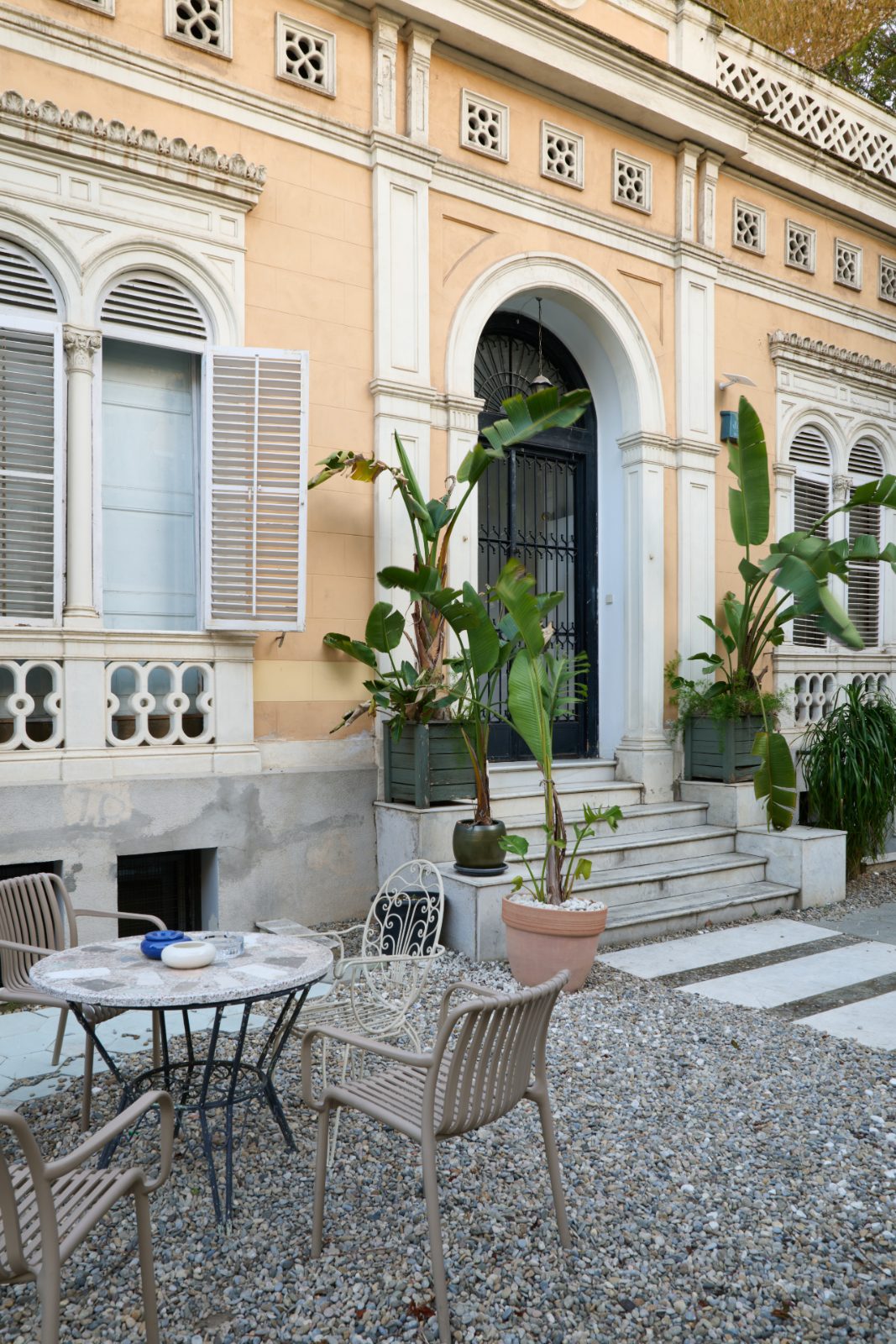 Courtyard cafe with ochre facade