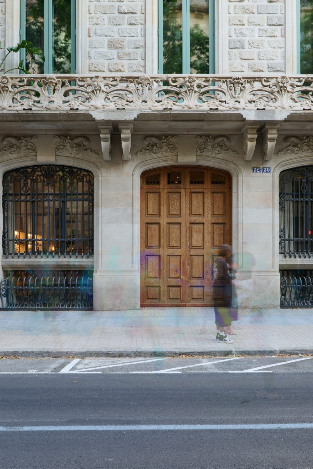 Modernist facade and carved wooden door of the building