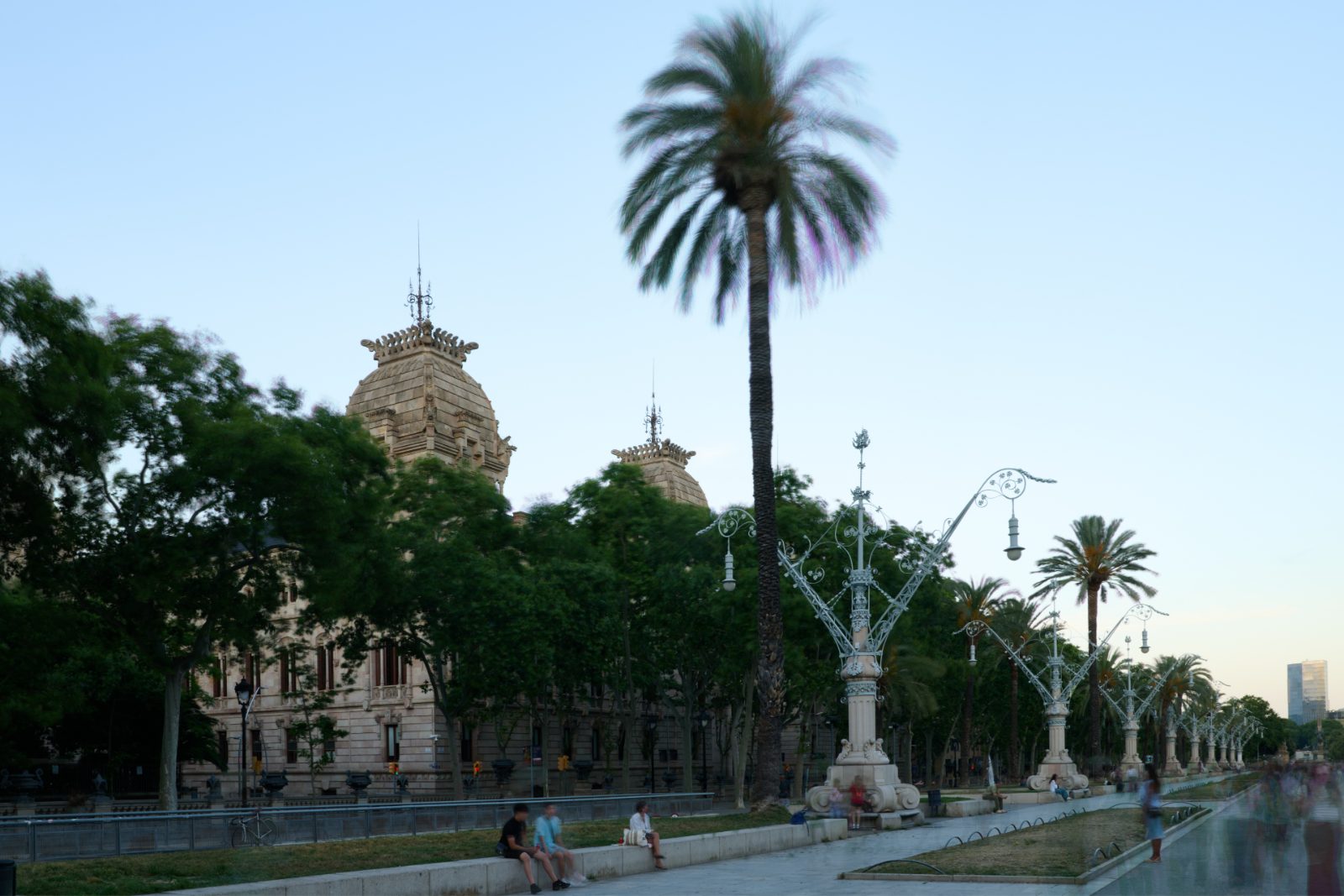 Palm-lined promenade with Modernist lampposts
